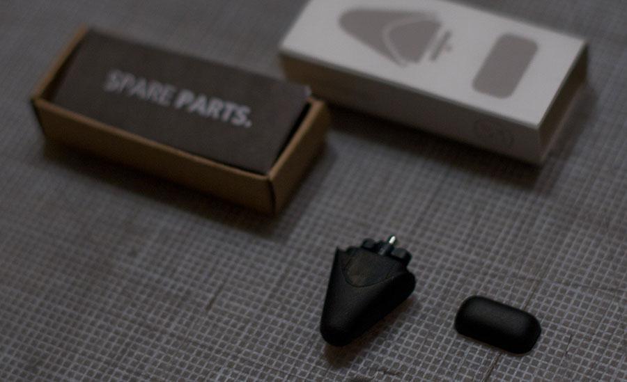 Close-up of Pencil’s tip and replacement packaging. Manual reads "SPARE PARTS."